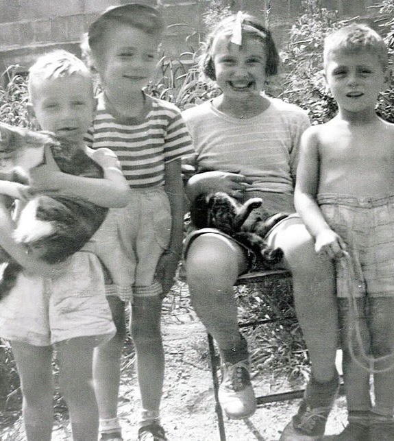 Pauly with cat Lady, Lainie, cousin Mary Frances with Tabby cat and Bobby